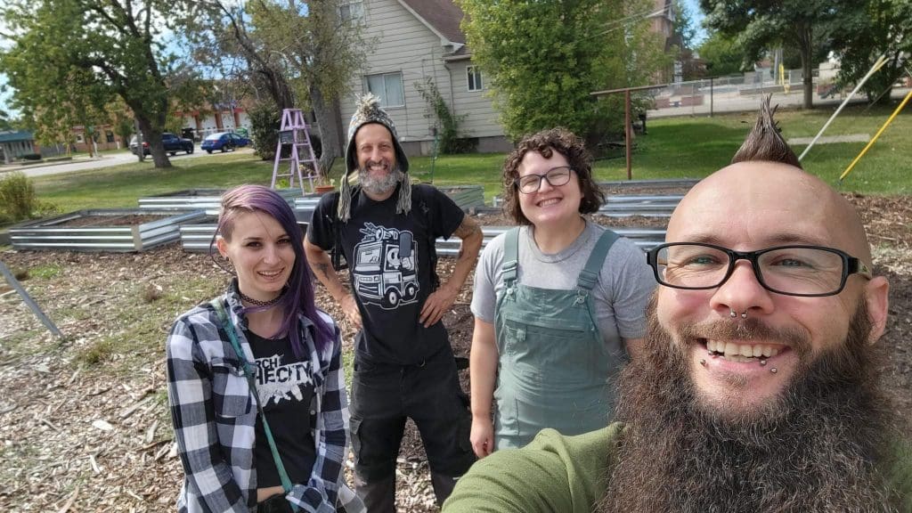 Fusion Marketing Fusion Marketing Donates Flags and Installs a Flagpole at the Eastpointe Community Garden John Shay Bill Katie